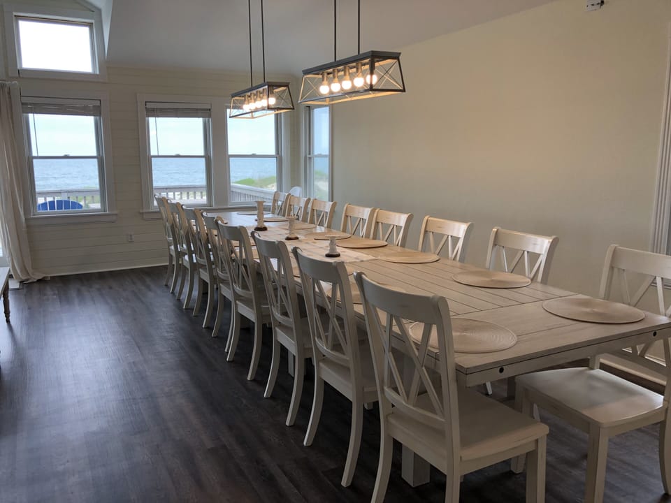 Two large new dining tables and chairs to seat 16.