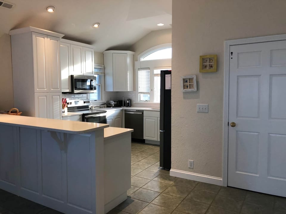 Kitchen with additional peninsula seating.