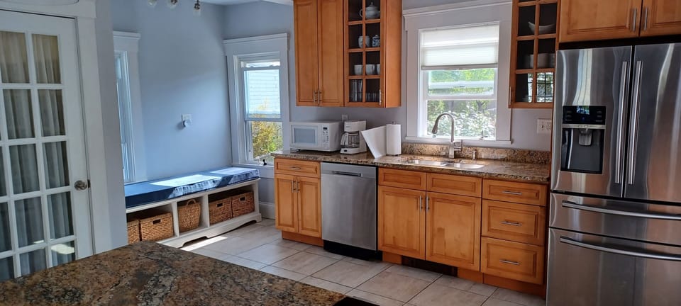 Kitchen with dishwasher and seating area