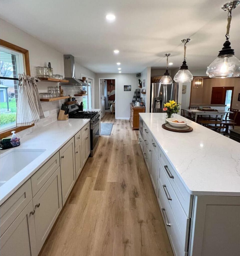 Large open concept kitchen with all appliances and cooking basics 