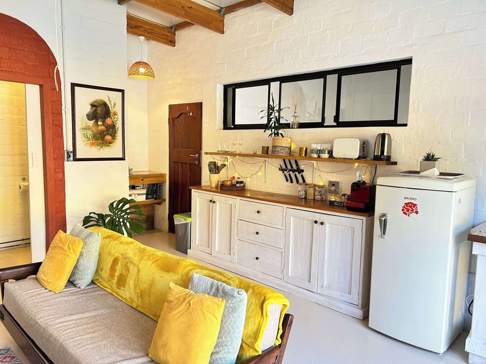 Open plan living area and kitchen area.