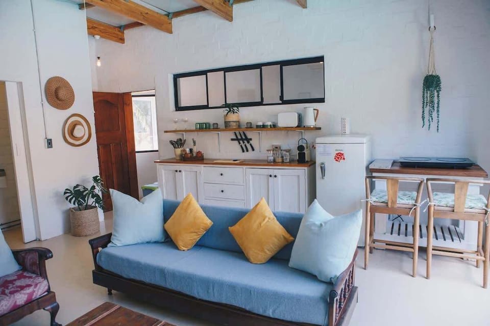 The kitchen area. Equipped with airfryer style oven, induction stove, fridge, Nespresso machine, Kettle and toaster.