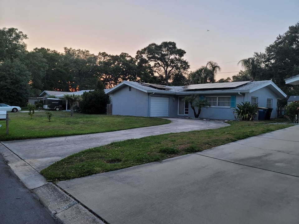 Side view of front of house with driveway 