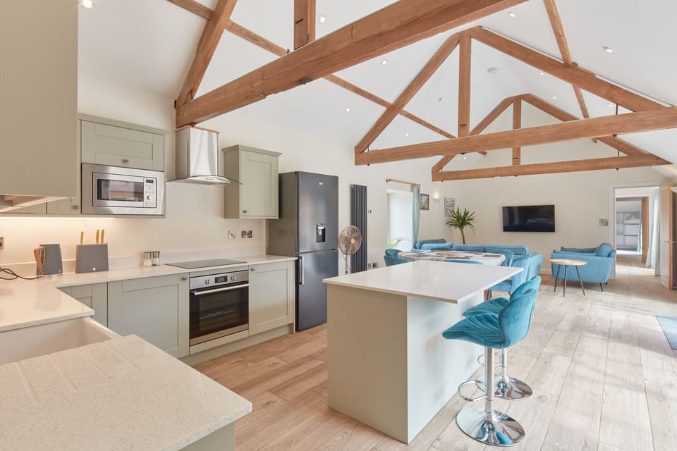 Large living area with underfloor heating and radiators