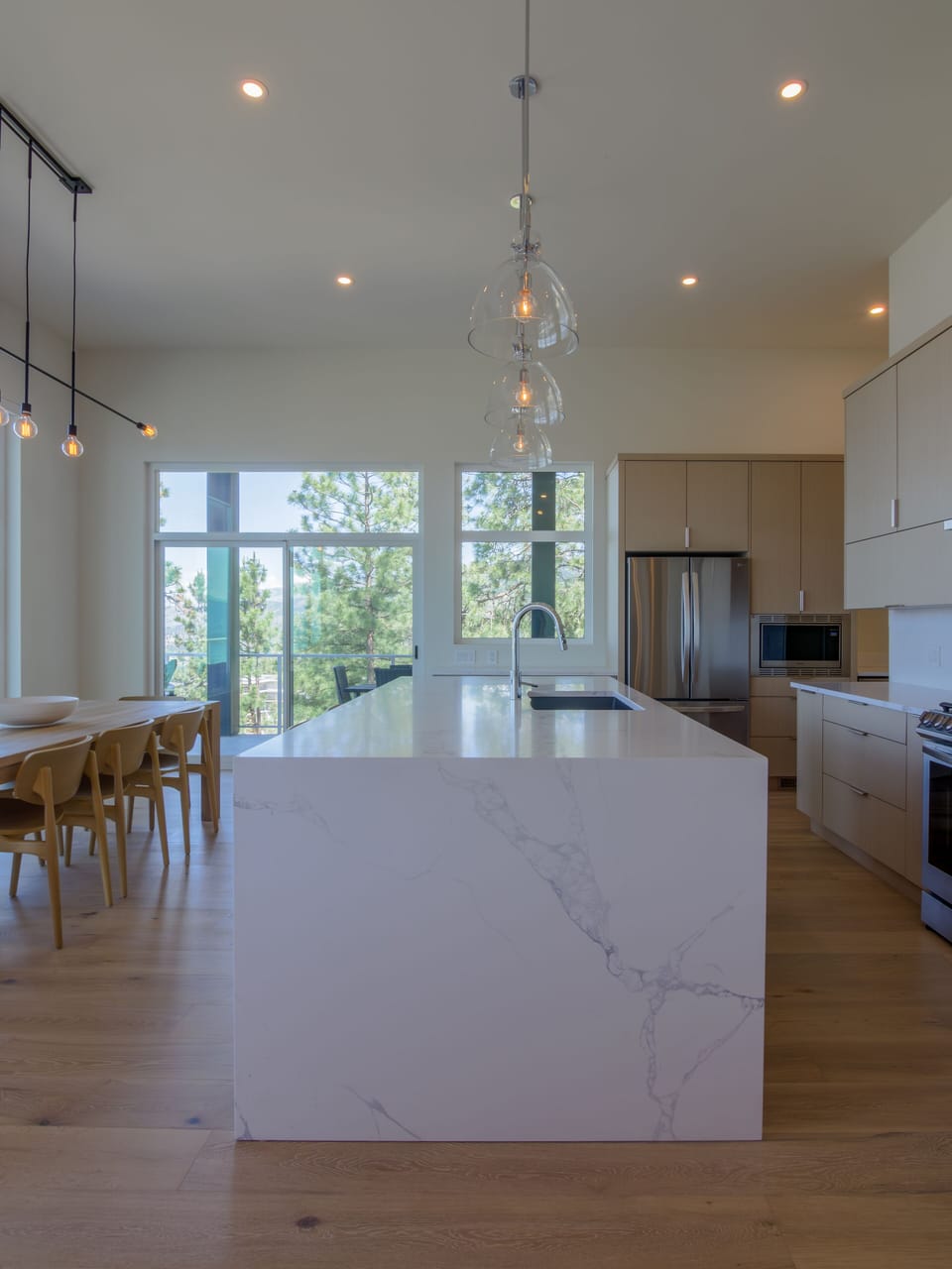 Large well equipped kitchen with quartz waterfall island to prep gourmet meals
