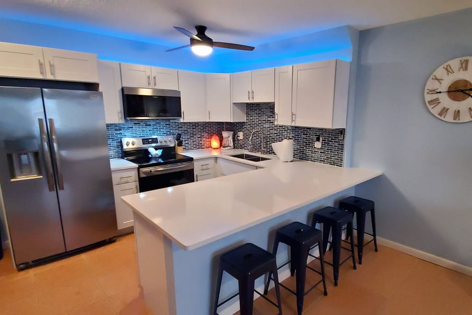 Large counters make prepping meals easy and provide lots of space for dining. 