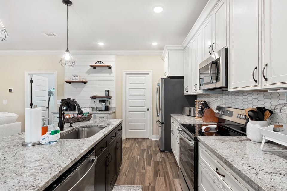 Open kitchen space with island and coffee bar