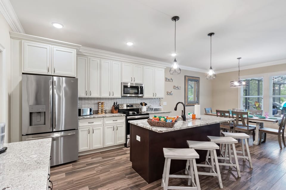 Gourmet kitchen with large island with seating for 4. Beautiful granite counters