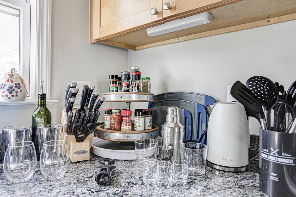 Full selection of cooking utensils, knives, glasses and barware, plus a kettle