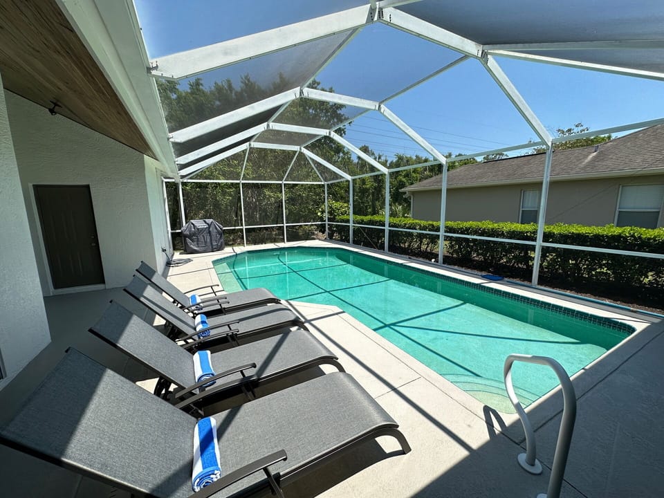 4 sun loungers poolside