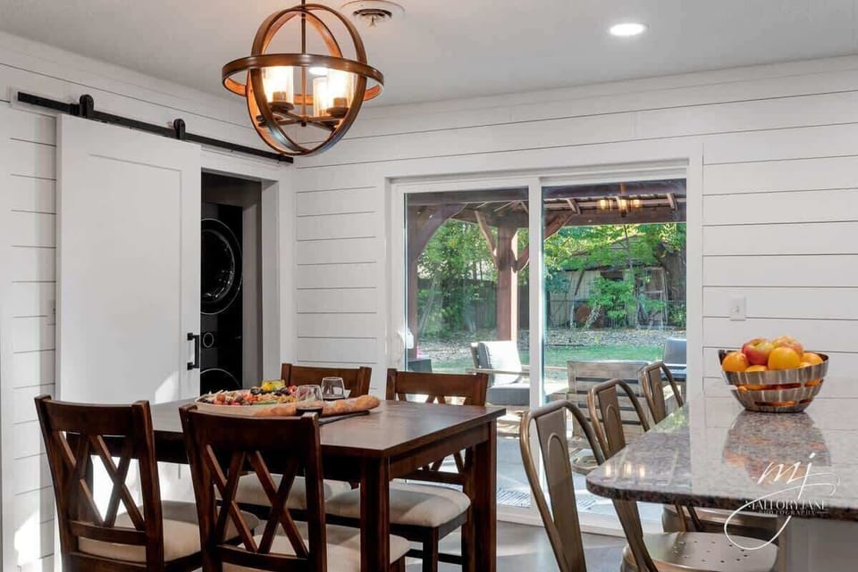 Gather for meals and board games at our light‑filled dining table, just steps from the gourmet kitchen.