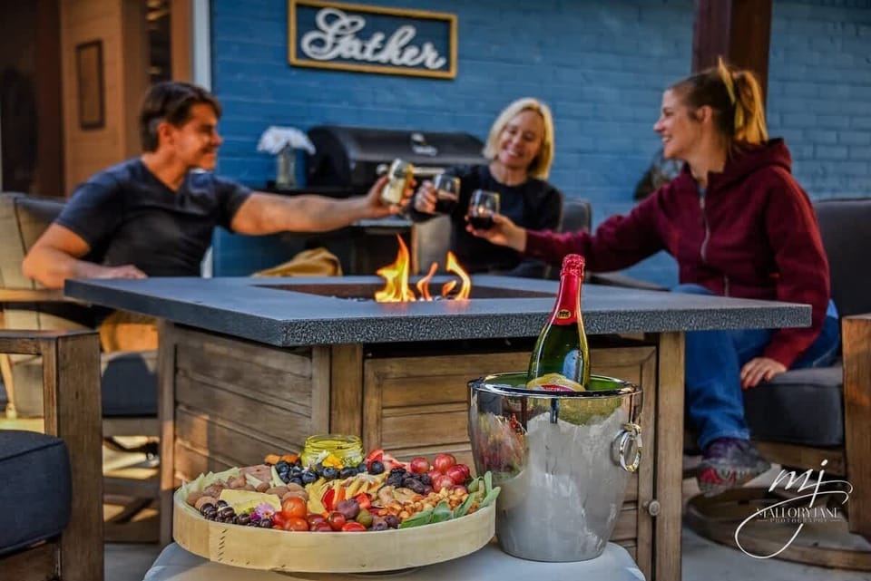 Gather around the fire pit in our backyard oasis.