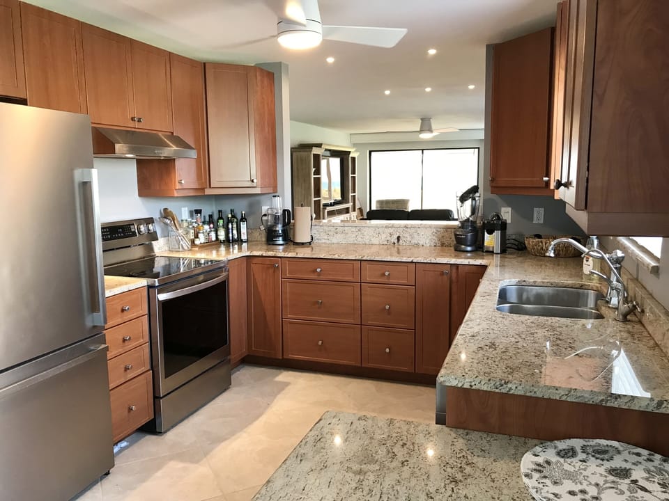 kitchen with new appliances, granite