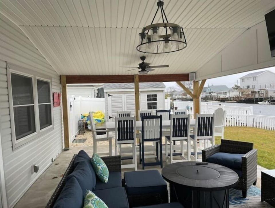 Backyard patio with TV and propane fire pit