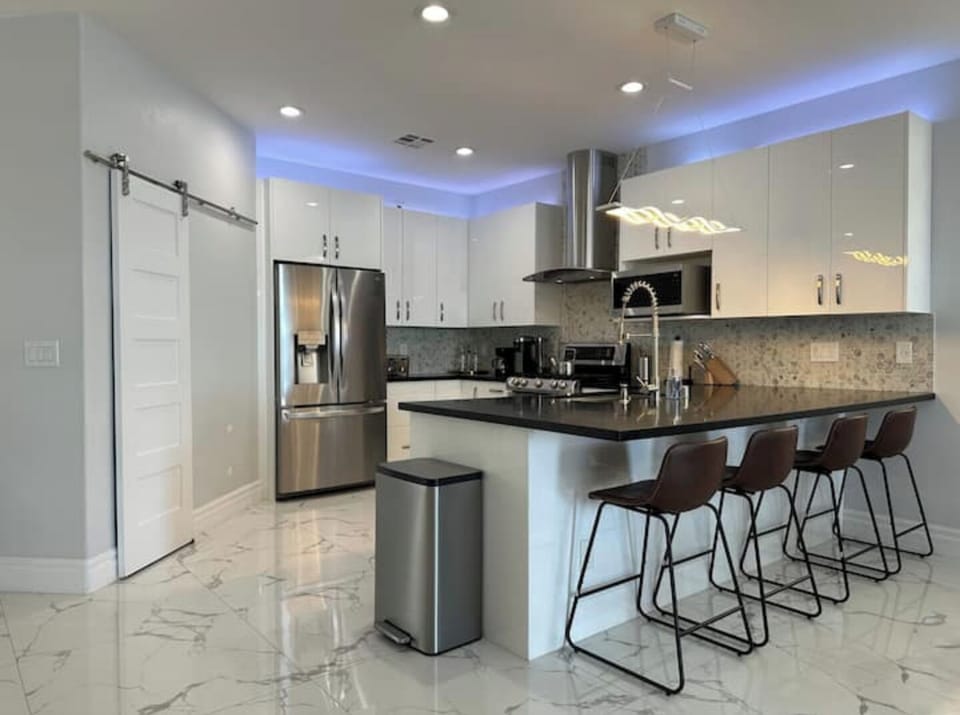 Spacious counter top with seating for 4 guests.