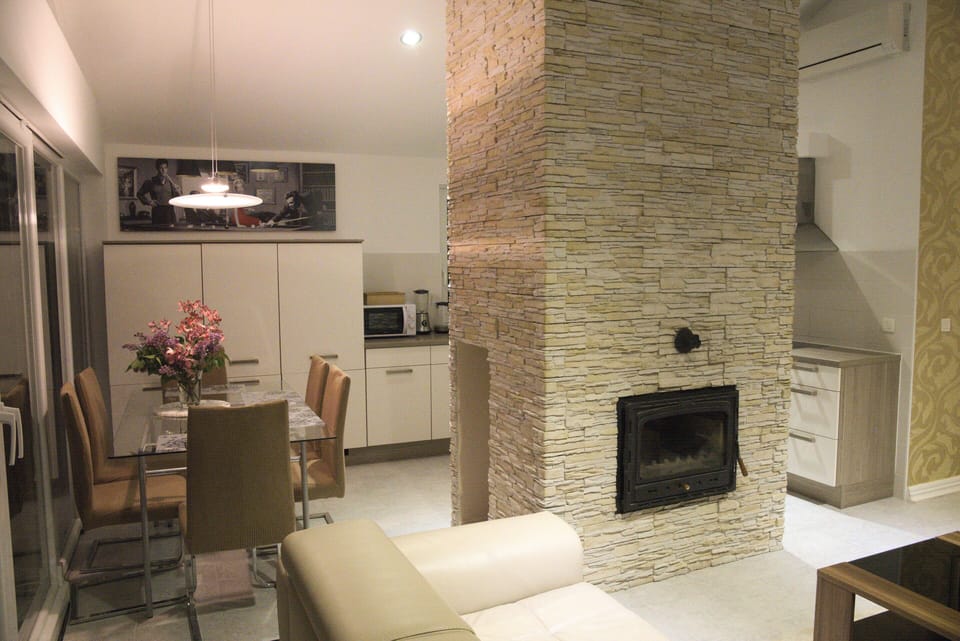 Fireplace, dining table, kitchen