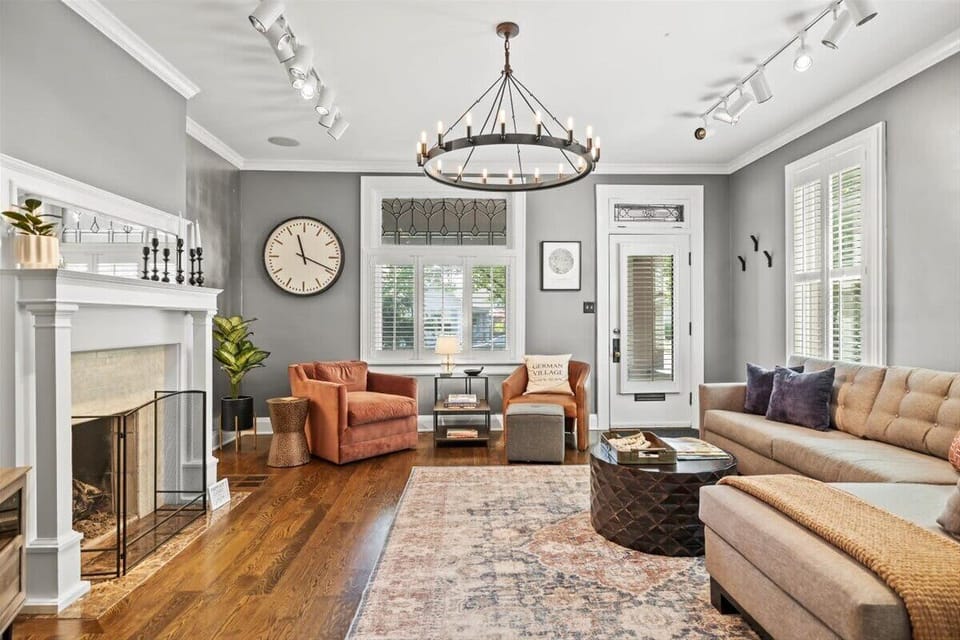Living room with an open and airy feel with views out to the street and front porch