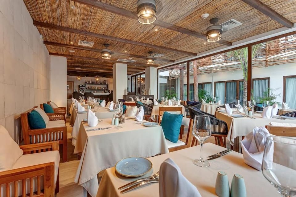Linger over cocktails in the bright, stylish dining room.