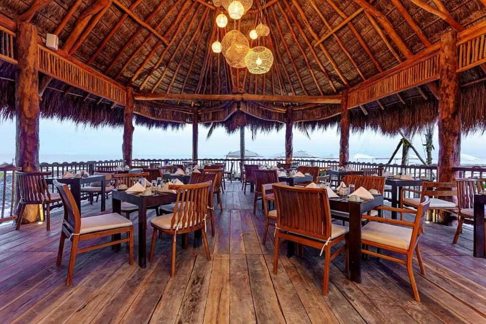 Dine under a thatched roof with ocean breeze all day.
