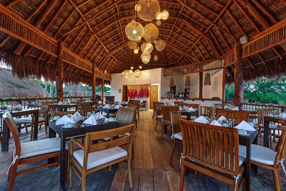 Gather for relaxed meals in a warm, open-air setting.