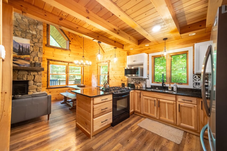 The fully equipped kitchen is open to the elegant living and dining area.