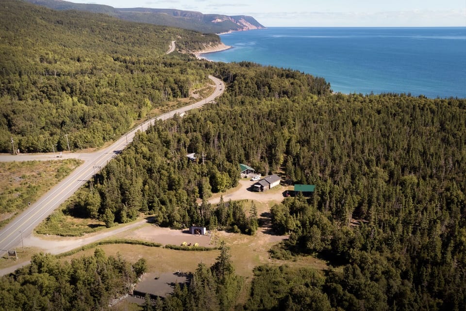 View with the Cabot Trail and Cape Smokey mountain in the distance.