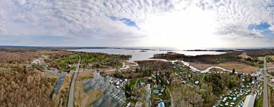 Panoramic looking west over North Sandy Pond and Lake Ontario.