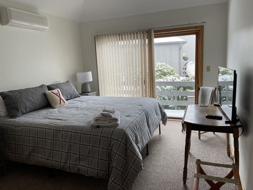 Bedroom 2: First floor king bedroom with attached private full bathroom.