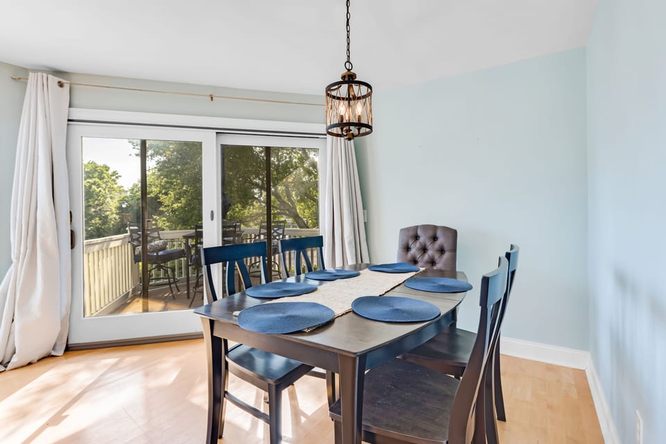 Dining Area seats 6 with slider doors onto the deck table setting.