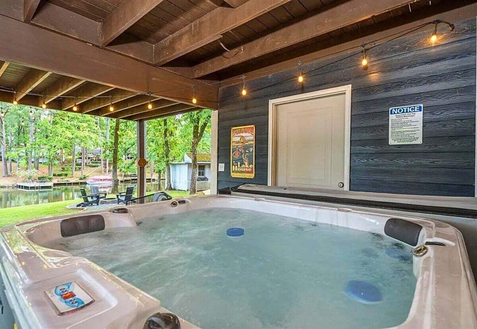 [Hot Tub] Indulge Yourself in the Ultimate Relaxation with our Premium Hot Tub, Where you can Unwind and Soak Away the Stresses of Everyday Life while Savoring the Picturesque Lake Views.