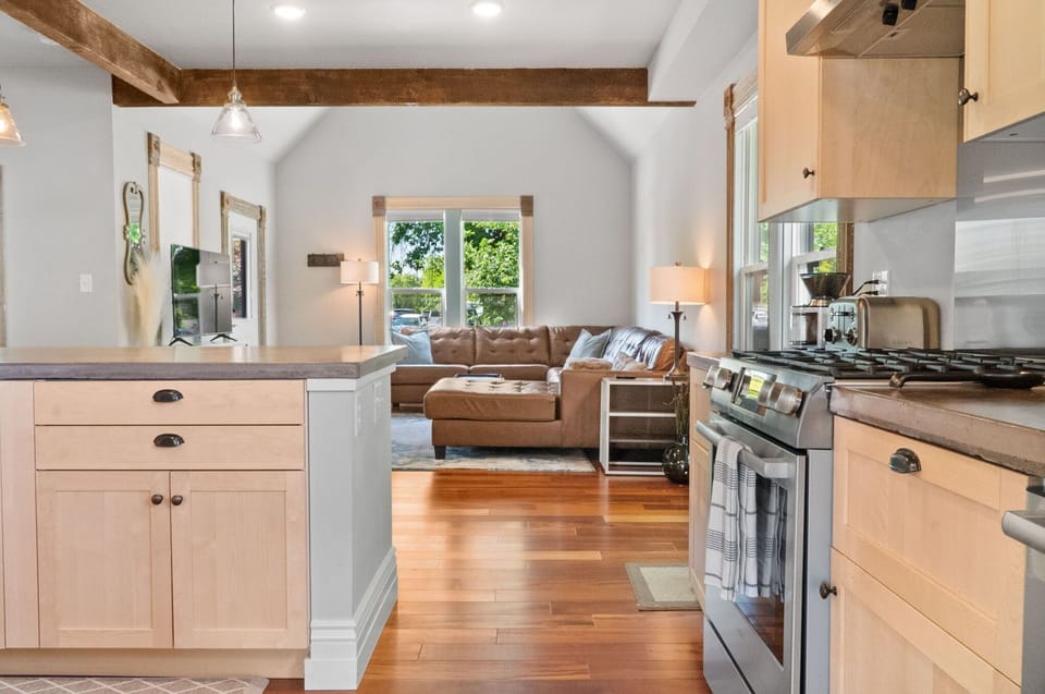 Living room opens to both the dining room and kitchen