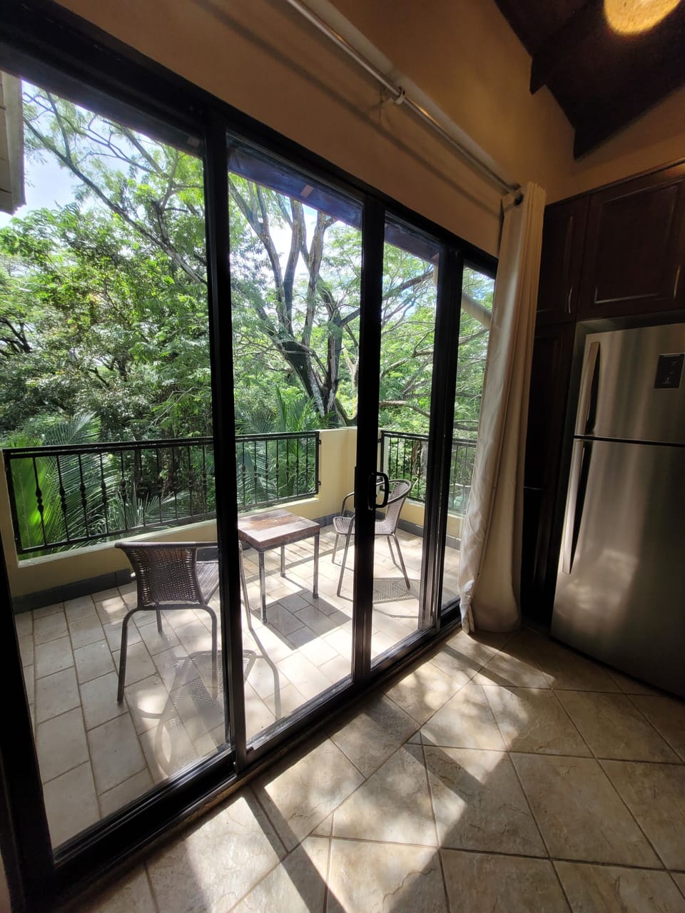 Balcony off the kitchen offers green space views