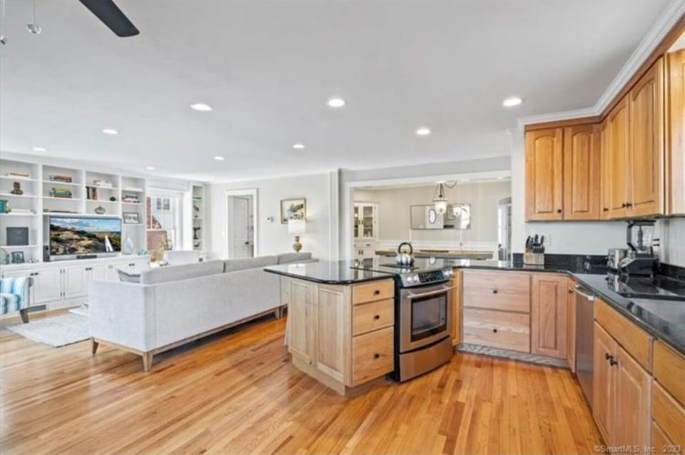 Open kitchen plan into the family room. New photos w/ update white cabinets t/c.