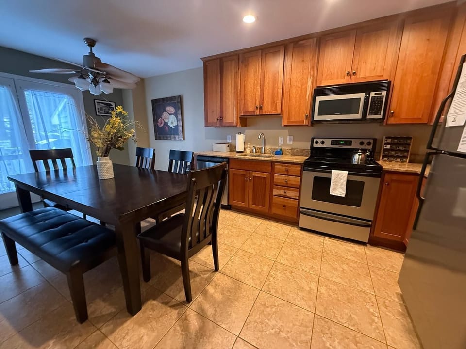 Fully stocked kitchen with oven, microwave, coffee maker, dishwasher and more! 