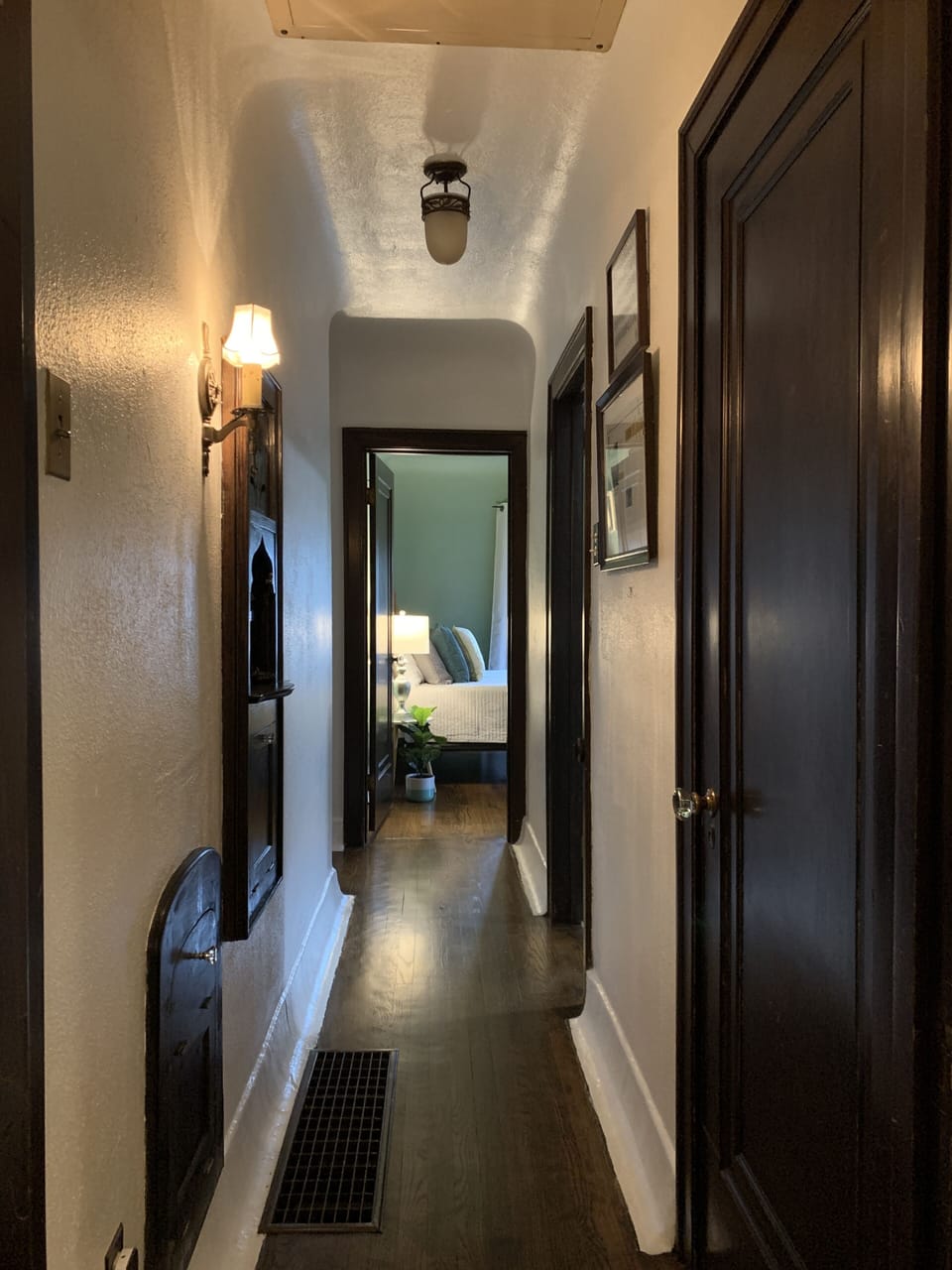 Hallway leading to main floor bathroom and two bedrooms