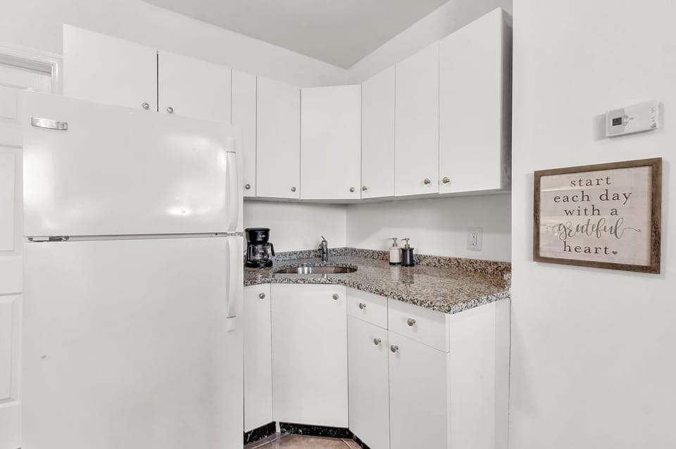 Fully equipped kitchen with modern appliances and ample counter space for all your cooking needs.