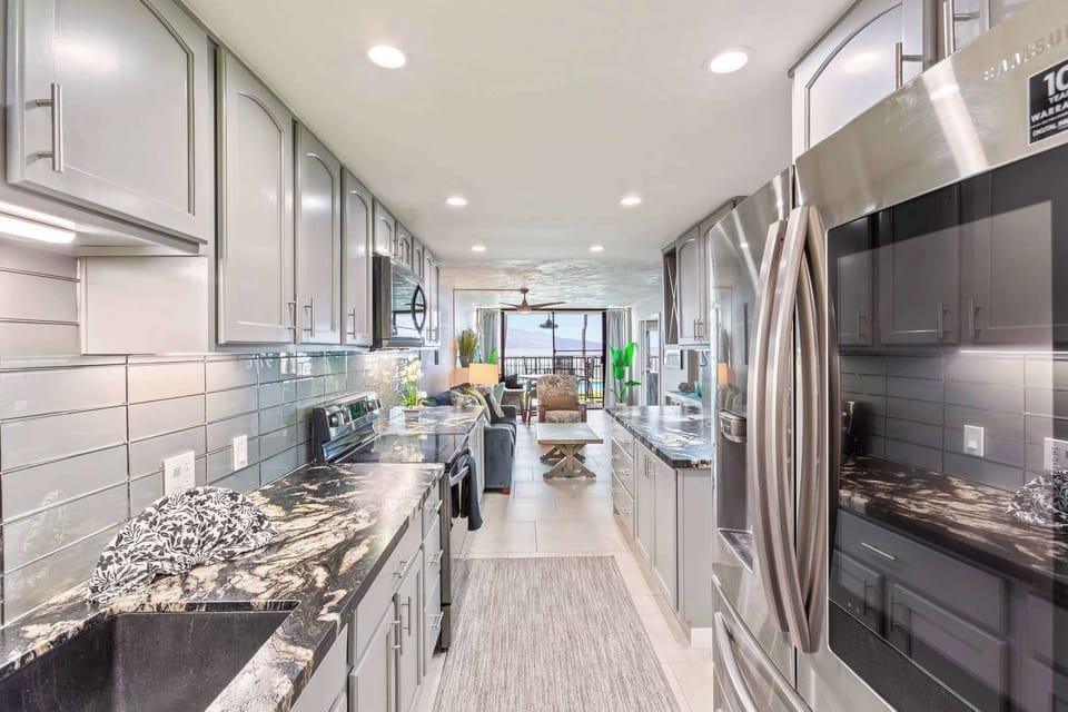 Whip up island-inspired meals in this sleek, ocean-view kitchen—fully stocked, Insta-worthy, and steps from the living room and lanai. 🌺🍳🌊