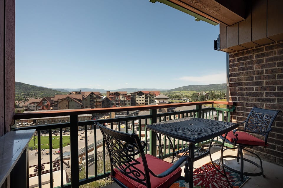 Sip your morning coffee on this private balcony while soaking in stunning mountain vistas and charming village views.