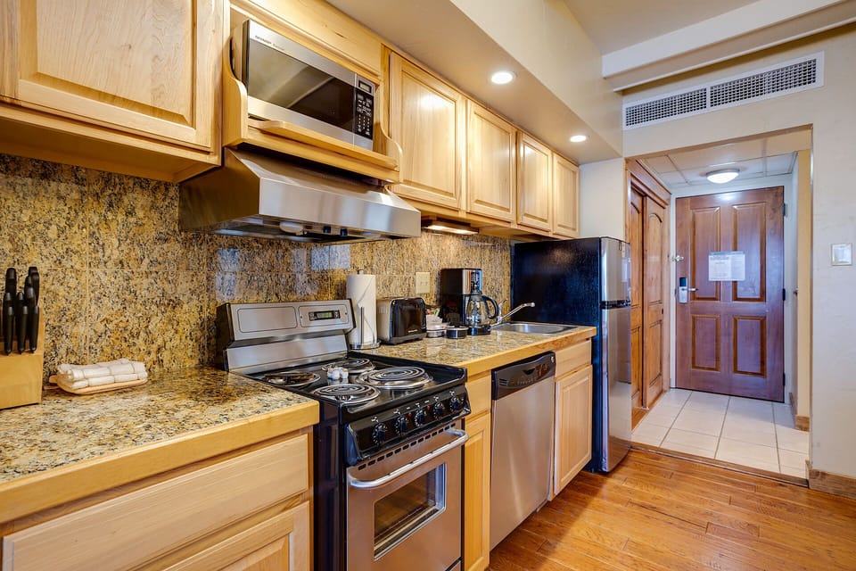 Your fully equipped kitchen features granite countertops, stainless steel appliances, and everything you need to create memorable meals during your stay.