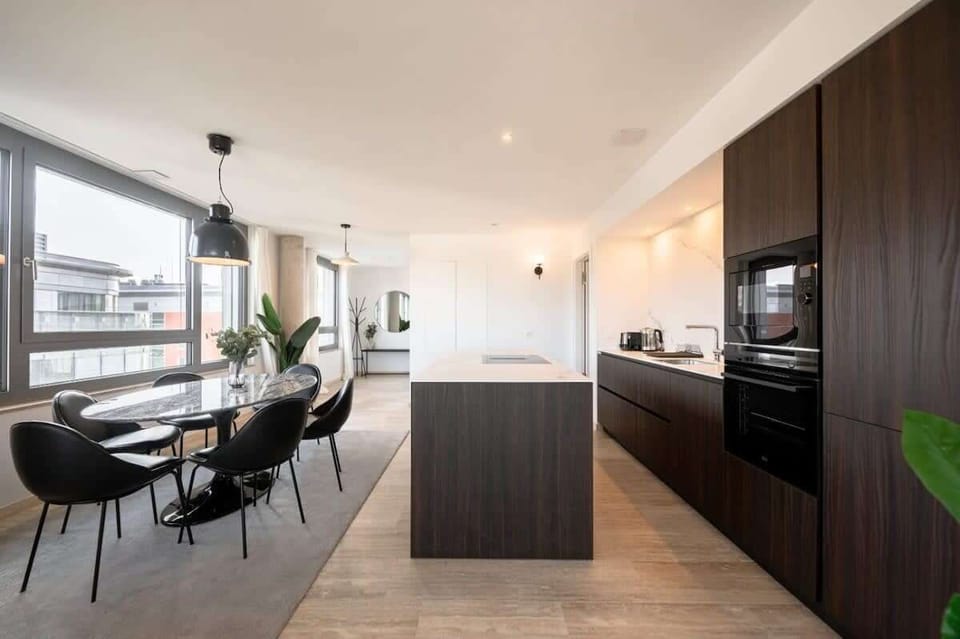 Enjoy your meals in our elegant dining area with open kitchen layout.