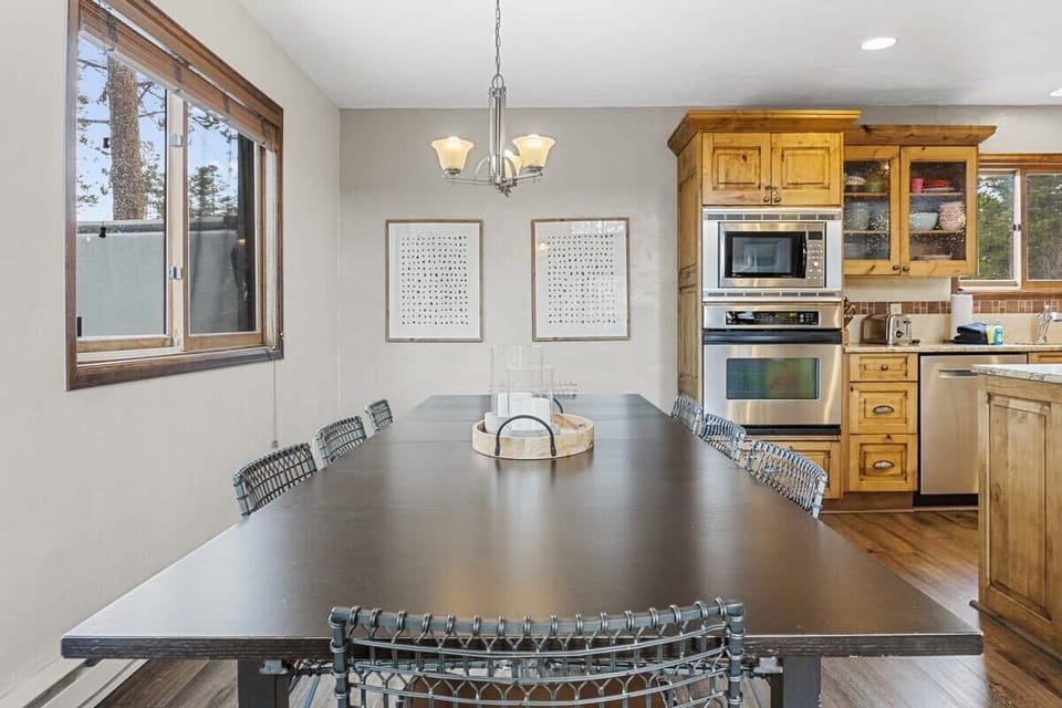 The dining room features a large table with seating for 8 right next to the kitchen making it easy to bring.