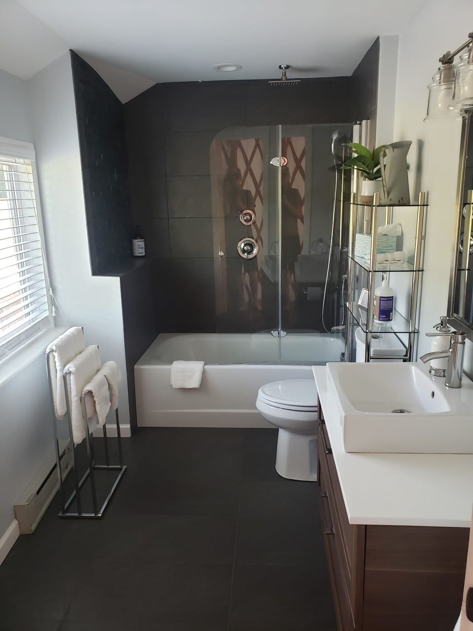 5 star ensuite bathroom with tub, hand shower, and rain shower.