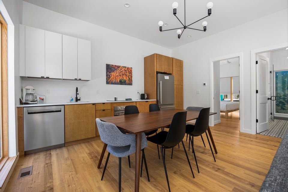 Dining room and kitchen with door to bedroom and bathroom
