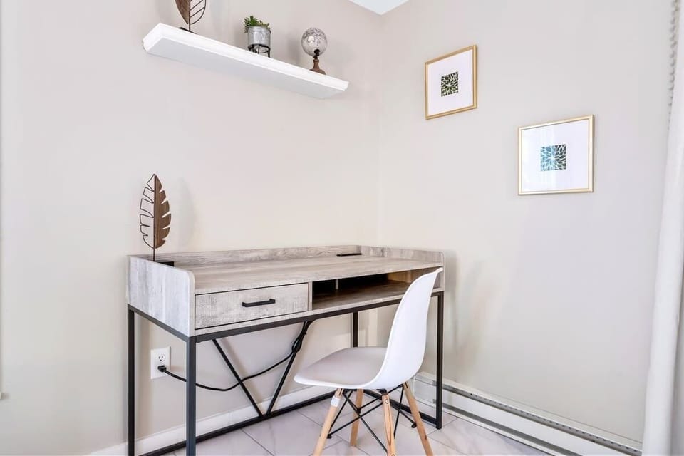 A quiet corner with a minimalist desk and chair offers a dedicated spot to work, write, or focus without distraction.
