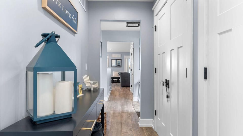 Bright, airy hallway leading to main living spaces