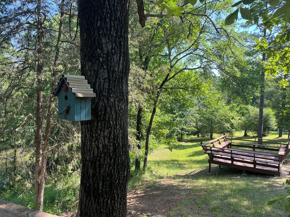 Shared firepit and deck, at end of cabin 1.