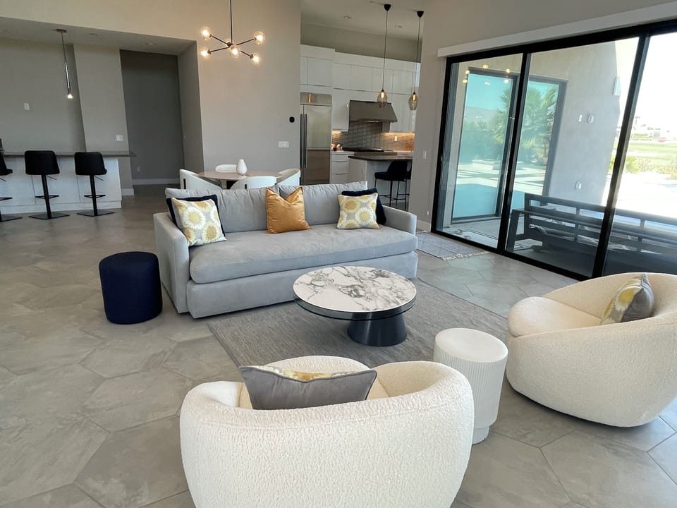 Great room with wetbar with mini fridge and sink, seating for 3
