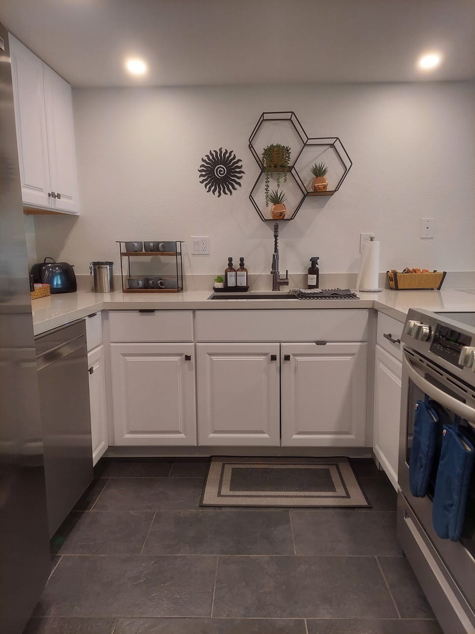 Kitchen-stainlss steel appliances. microwave, drip coffee maker, keurig, toaster