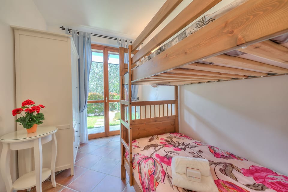 Bedroom with bunk beds and wardrobe and terrace access