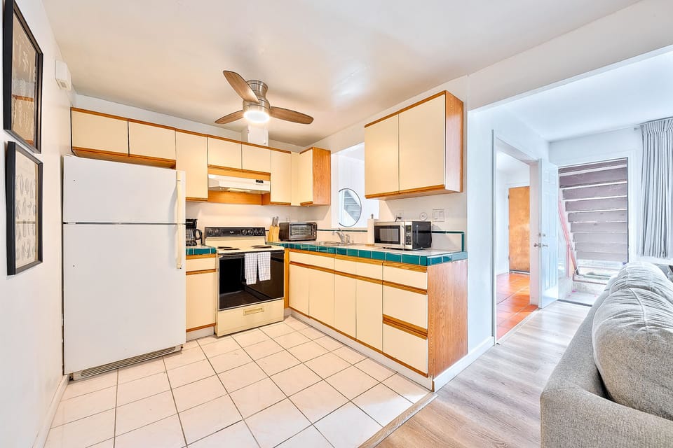 Kitchen with stove, oven, microwave and refrigerator